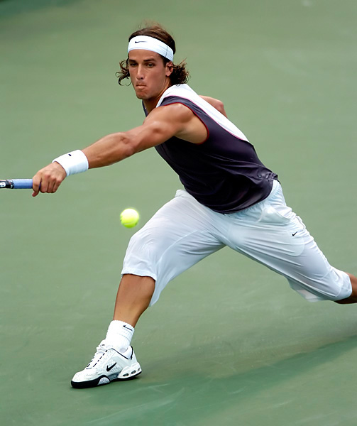 Feliciano Lopez, of Spain, chases a wide shot by James Blake, of the US