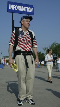 Tournament Director Jim McIngvale walking the grounds and giving information to fans